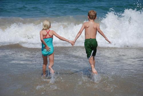 Youths playing in the ocean